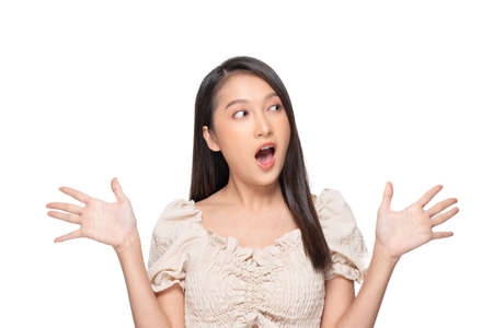 Excited Asian young woman smiling and happiness. Cheerful female with casual looking at camera and surprise isolated on white background. Expression shock price or mock up for display discount productの写真素材