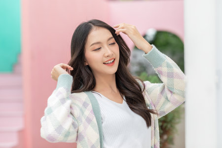 Beautiful asian young woman smile and cheerful. Confident cute female looking at camera relax and happiness with wellness life. good moment and positive emotional. Happy woman enjoy her life conceptの写真素材