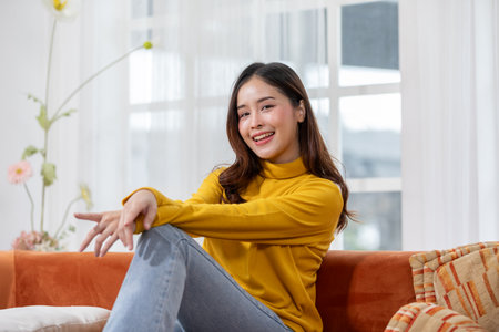 Beautiful asian young woman smile and cheerful. Confident cute female looking at camera relax and happiness with wellness life. good moment and positive emotional. Happy woman enjoy her life conceptの写真素材