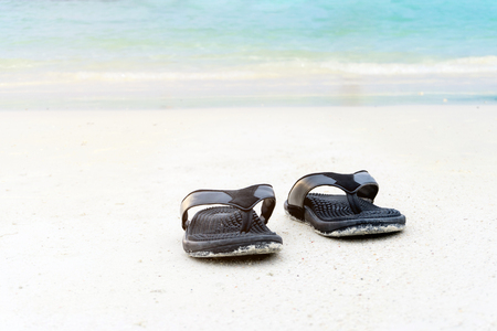 Sandals on the sandy beach summer conceptの写真素材