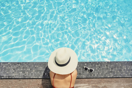 Carefree woman relaxation in swimming pool summer Holiday conceptの写真素材