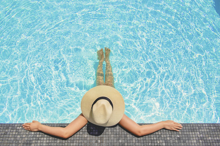 Carefree woman relaxation in swimming pool summer Holiday conceptの写真素材