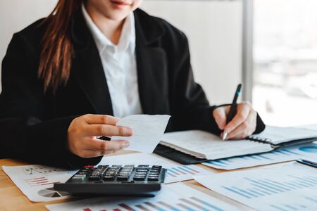 Business woman  Accounting Financial investment on calculator Cost Economic business and marketの写真素材