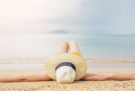 Asian women relaxing in summer holiday on beachの写真素材