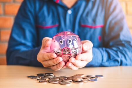 Man calculator Accounting Calculating with Piggy bank money stack step growing saving moneyの写真素材