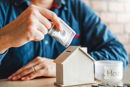 Man calculator Accounting Calculating with money stack step growing saving money for Homeの写真素材