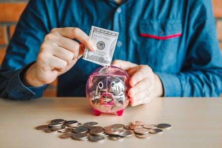 Man calculator Accounting Calculating with Piggy bank money stack step growing saving moneyの写真素材