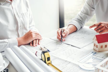 Team Engineer drawing graphic planning and meeting for architectural project on workplaceの写真素材