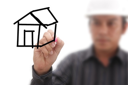 A man is drawing a homeの写真素材