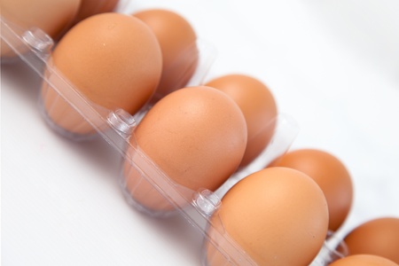 Chicken egg on white background