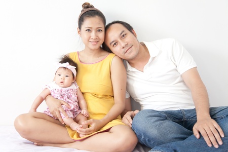 Happy of a new family on white background