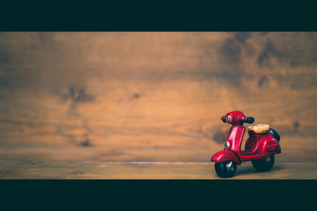 Red motorcycle on old and vintage rustic wooden background. using for Christmas greeting card, New Year and happy birthday present decoration concept,cenematic concept.の写真素材
