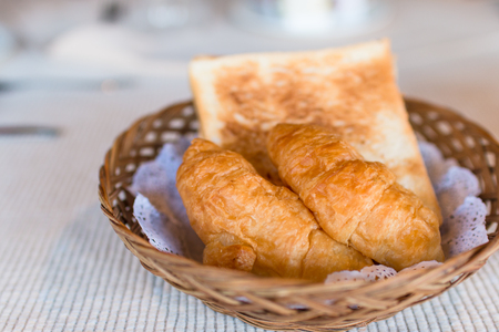 Fresh baked croissants on breakfast table. Food concept, Breakfast in hotelの写真素材