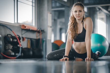 Portrait young attractive healthy woman body curve fitness doing exercises workout with ball in gym. People beauty perfect body slim fitness girl. Freedom happy and relax lifestyle healthcare concept. with copy space.の写真素材