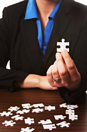 Woman with a puzzle pieceの写真素材