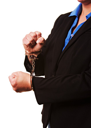 Businesswoman in handcuffsの写真素材