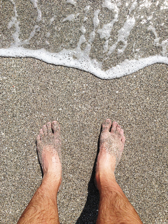 Standing on beachの写真素材