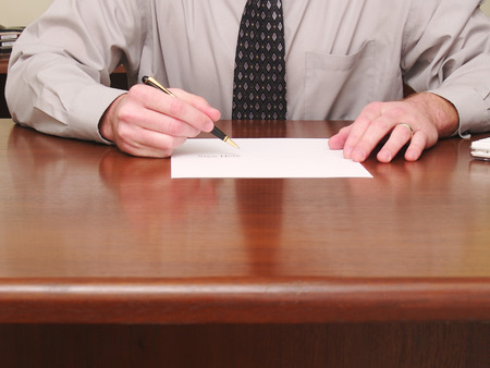Businessman with a contractの写真素材