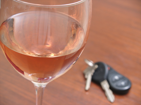 Wine glass with keysの写真素材