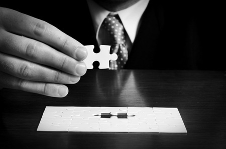 Businessman with a puzzleの写真素材