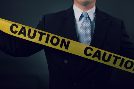 Businessman Caution Tapeの写真素材