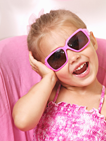 Little girl with sunglassesの写真素材
