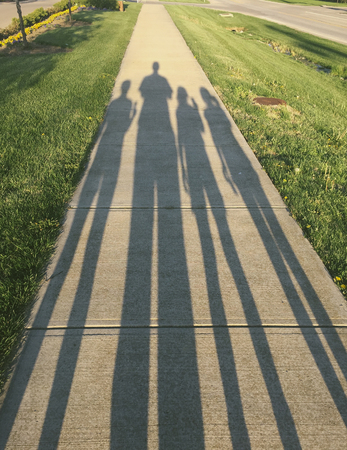 Shadow of family walkの写真素材