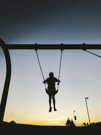 Child on a swingの写真素材