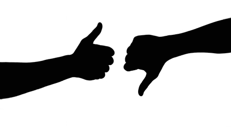 Thumbs up and downの写真素材