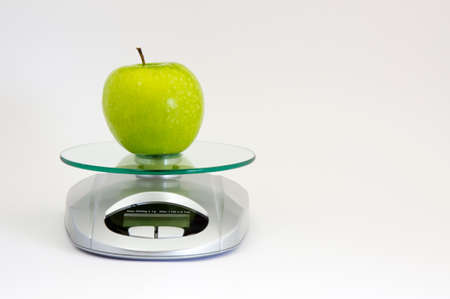 Green apple on weightの写真素材