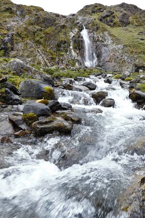 Small Andean waterfall from the snowy verdish. Huancayo, Peru
