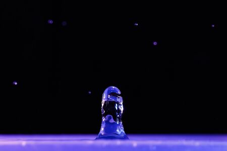 Sculpture of water after the drop of a drop on stored waterの写真素材