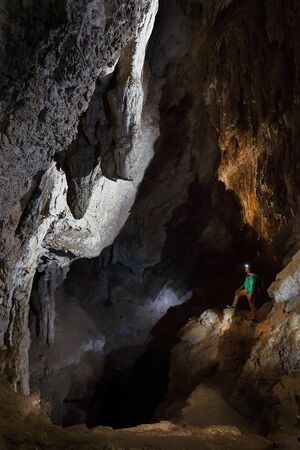 explorer inside the cave of Huagapo, practicing a little speleology.の写真素材