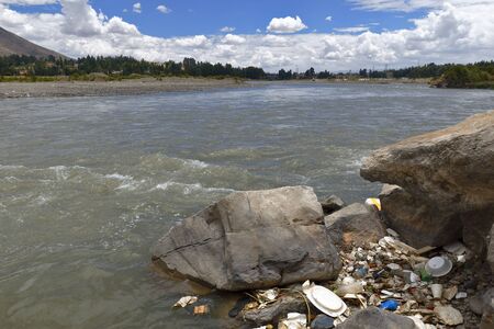 Shores contaminated with solid waste on the Mantaro Riverの写真素材