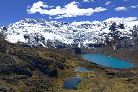 Sunset view of the snowy Huaytapallana next to lagoons in the central mountain range of the Peruvian Andesの写真素材