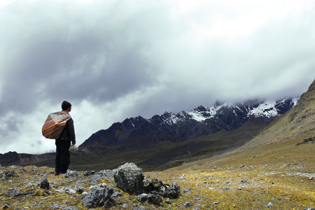 Andean inhabitant contemplating snowy landscape. Huancayo, Peruのeditorial素材