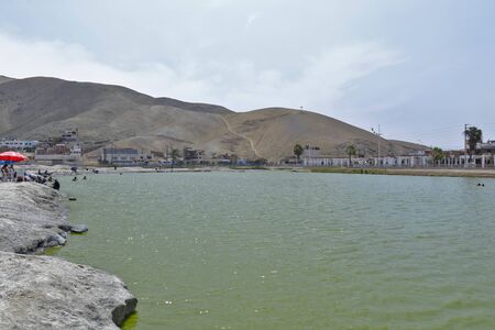 Chilca, Lima. November 24, 2019 - Scene showing the healing mud that the enchanted lagoon has in the Chilca district, has medicinal properties where many visitors come. Lima-Peruのeditorial素材