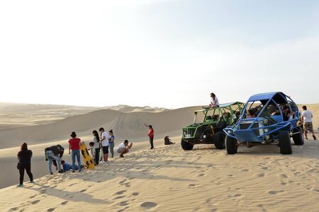 Huacachina, Ica. November 30, 2019 - a view of the amount of tourism and activities available when visiting the Huacachina oasis in Ica-Peru.のeditorial素材