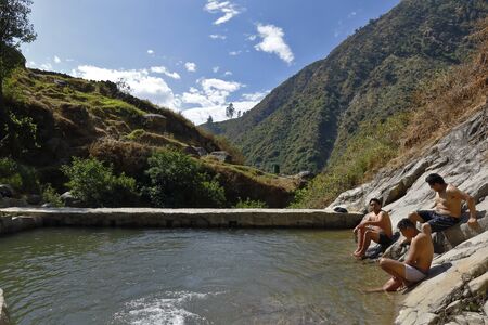 San Jeronimo de Surco, Lima. June 09, 2019 - Group of tourists in front of beautiful sunset view of the Palacala waterfall in the San JerÃ³nimo de Surco district.のeditorial素材