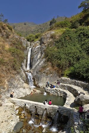 San Jeronimo de Surco, Lima. June 09, 2019 - Group of tourists in front of beautiful sunset view of the Palacala waterfall in the San JerÃ³nimo de Surco district.のeditorial素材