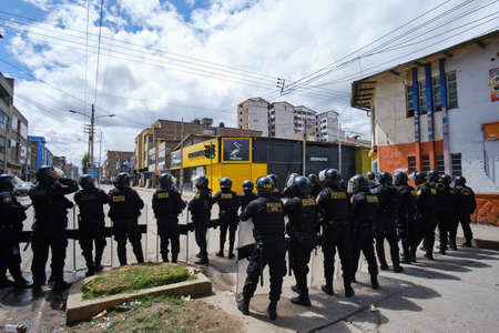 Huancayo. March 02, 2022. Civil demonstrations during the strike of transporters and farmers, there were clashes between police and the population with numerous injuries. Huancayo, Peru.のeditorial素材