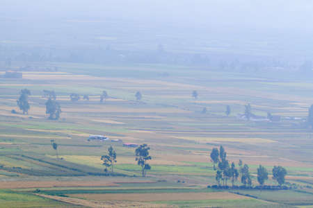 Scenario of agricultural crops in the Mantaro Valley at dawn even with fog.