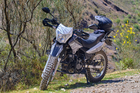 Detail of a motorcycle parked on the road during a trip to the interior of the country.の写真素材