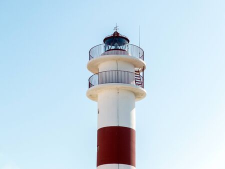 Lighthouse with red stripe and balconyの写真素材