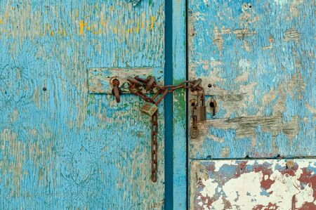 Blue door with chain and padlock