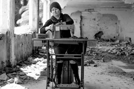 Seamstress with sewing machine