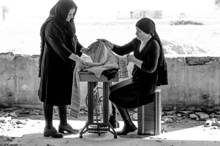 Seamstress with sewing machineの写真素材