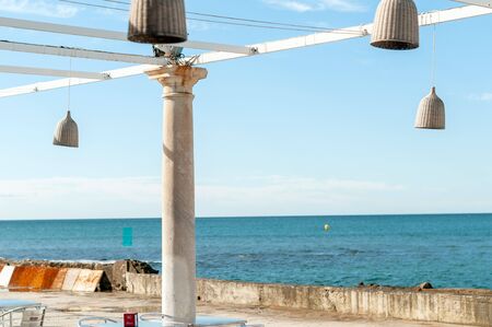 Outdoor lamps hanging by the sea