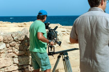 Camera operator with film cameraの写真素材