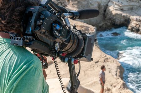 Camera operator with film cameraの写真素材